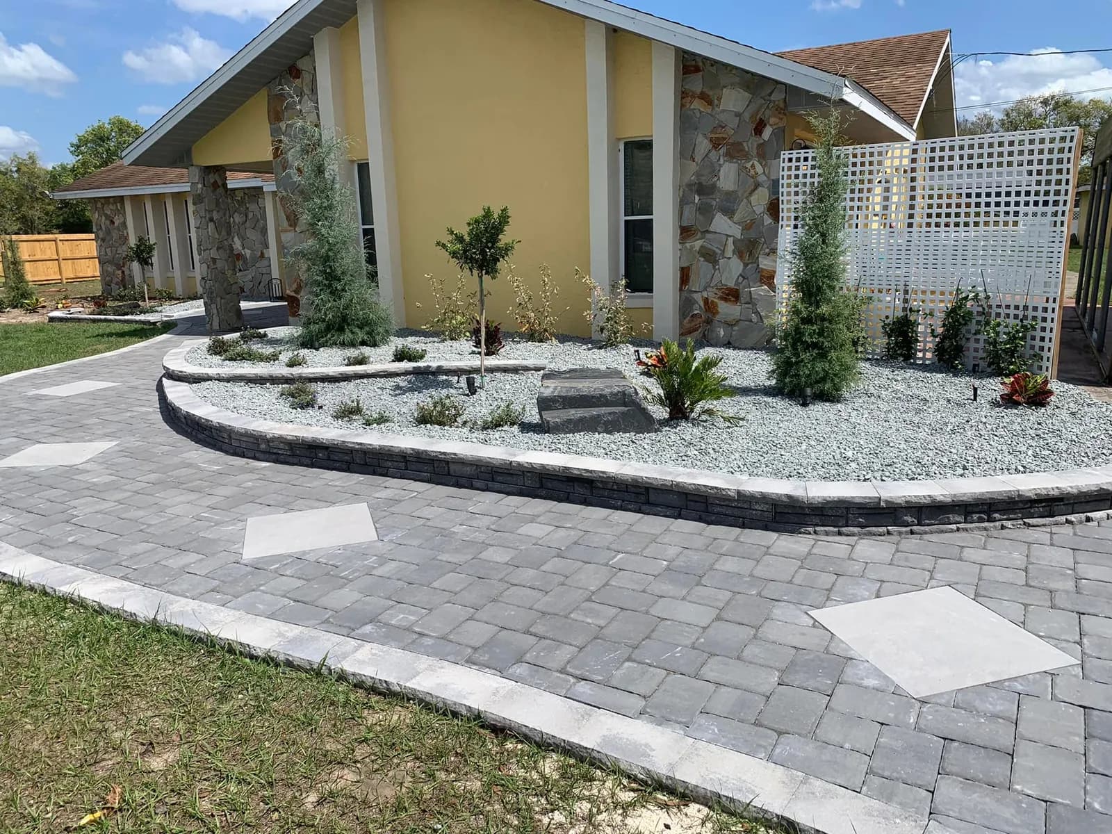 Curved paver walkway: patios work by Land & Stone in Belleview, FL